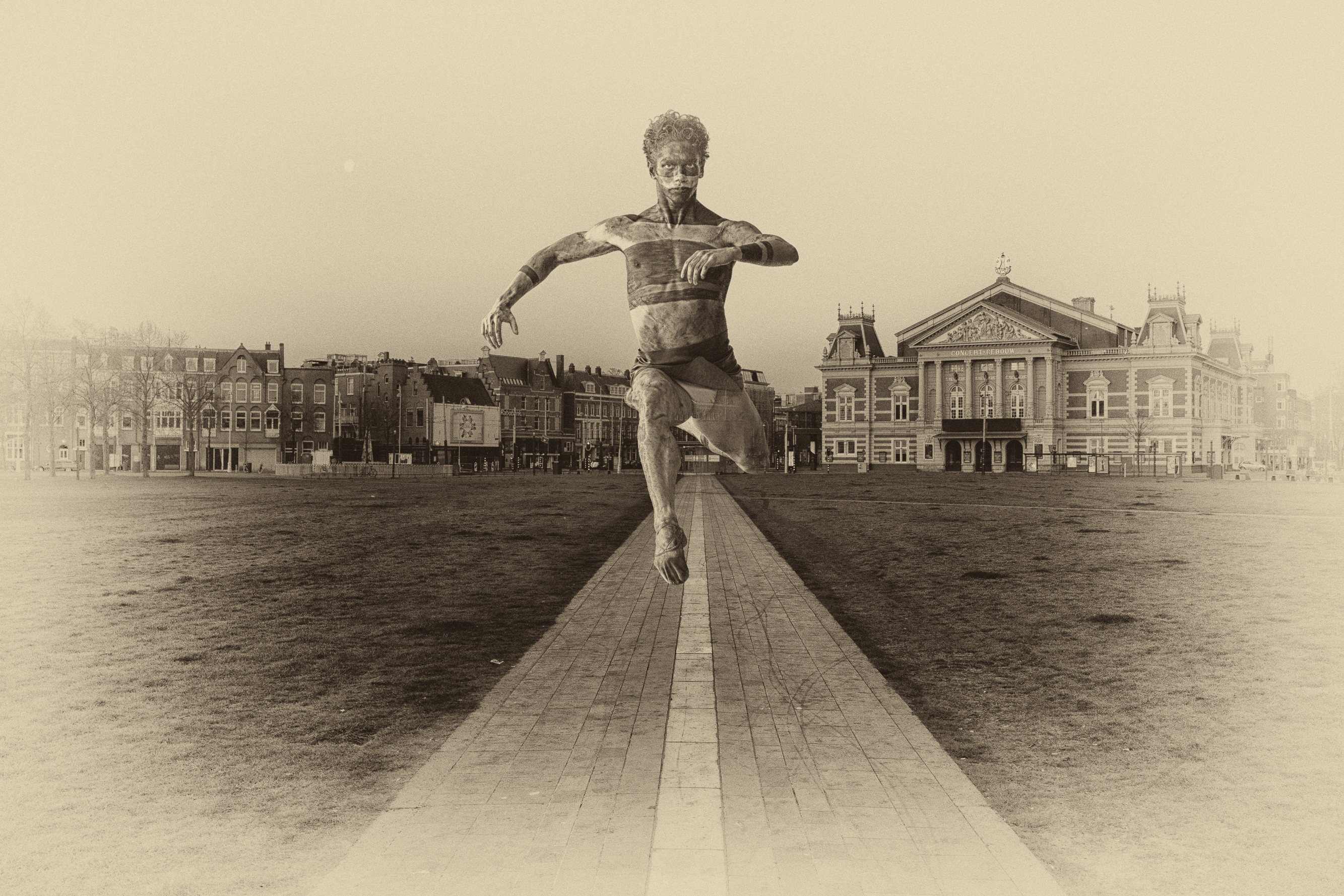 Dancer by the water with the Concertgebouw in the background