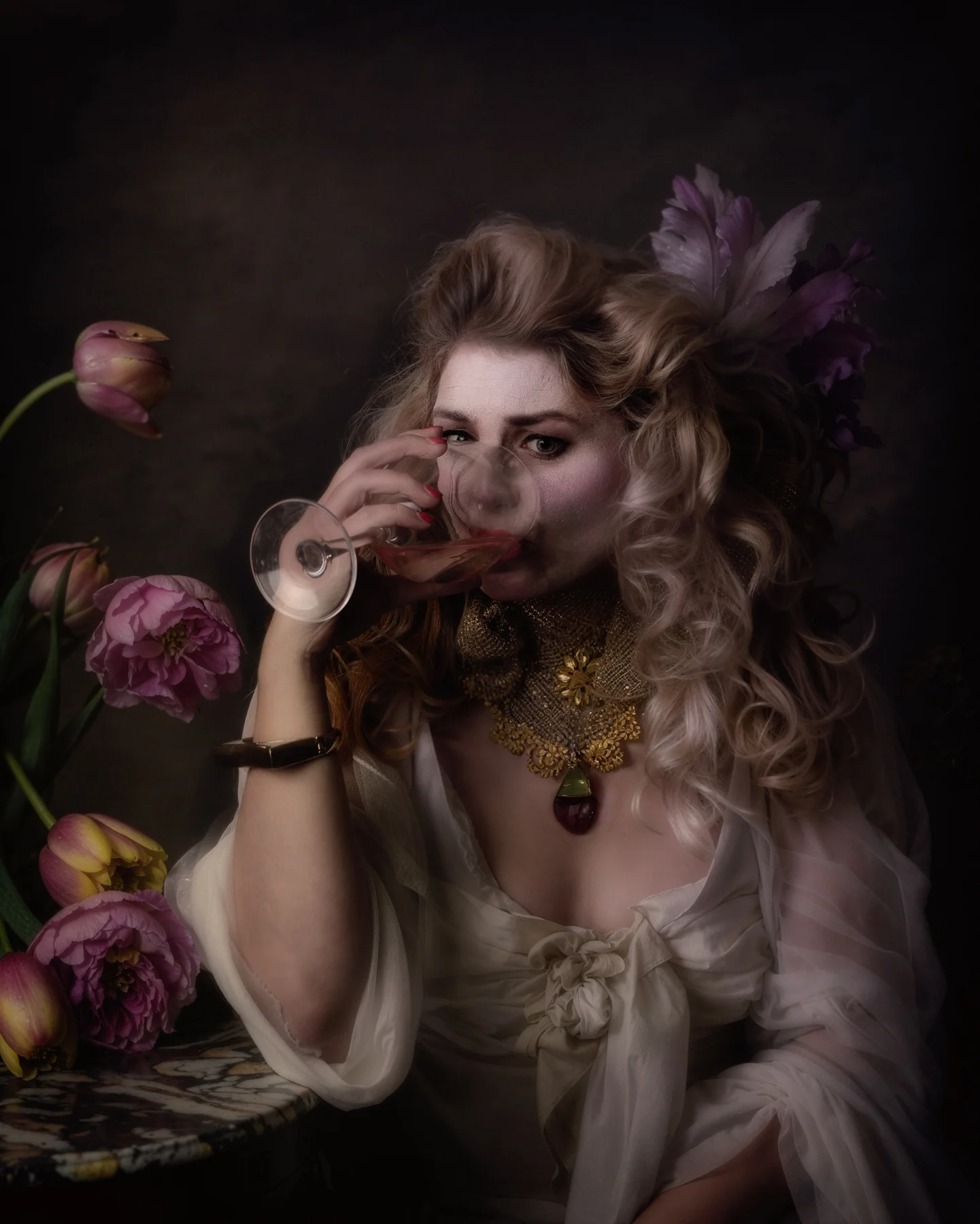 Portrait with a glass and flowers