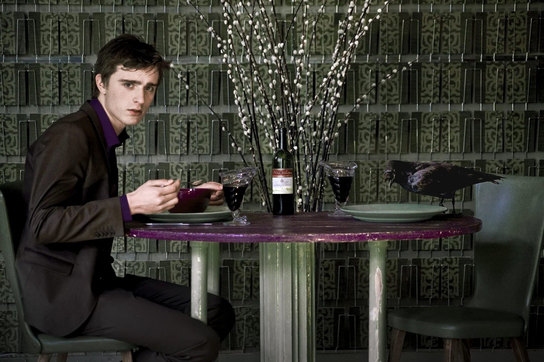 At the table with the raven