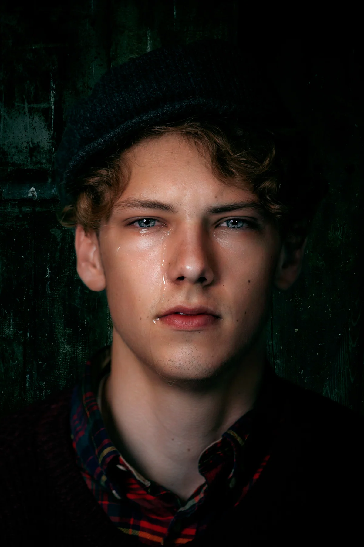 Frontal portrait with a cap