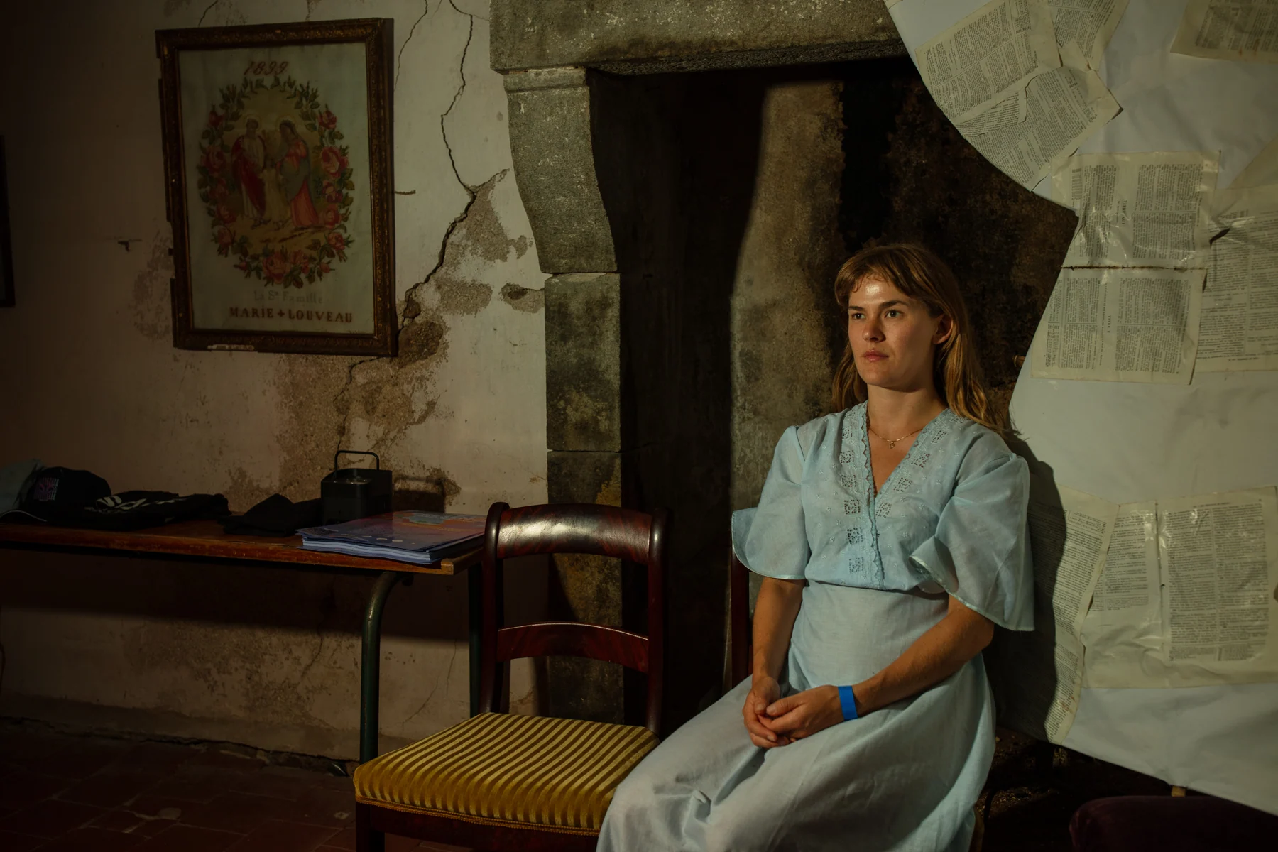 Blue dress by the fireplace