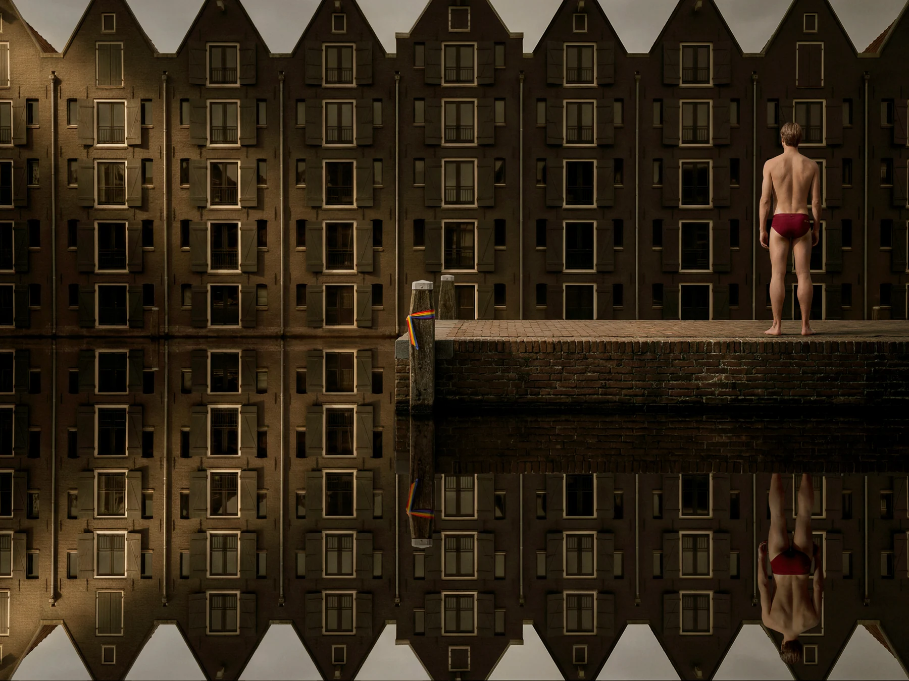 Red swimming trunks by the canal